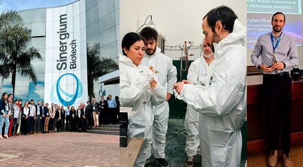 Investigadores de Sinergium Biotech con trajes de protección en el laboratorio